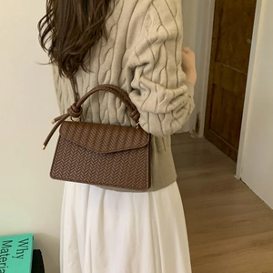 Dark brown woven crossbody bag with knot handle detail for women's autumn fashion