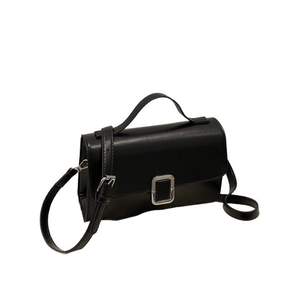 Retro black leather square crossbody bag with silver buckle and top handle shown at 45-degree angle