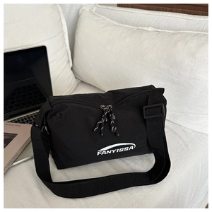 Detail of black waterproof crossbody bag with dual zippers and FANYISSA logo