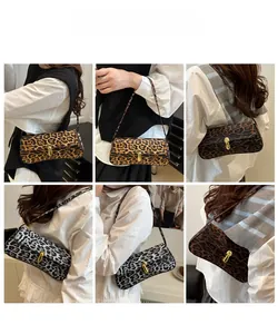 Leopard print baguette bag set with golden metal twist lock and thin shoulder straps