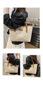 Detailansicht der Canvas-Tragetasche mit braunem Lederbesatz und elegantem Etikett