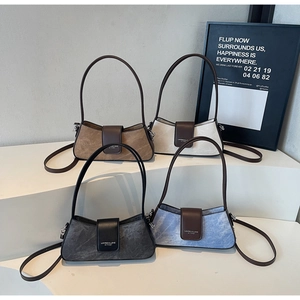 Detailed display of vintage baguette bags in four colors with textured suede finish