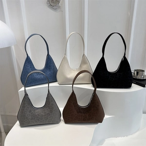Vintage leopard print hobo shoulder bags in five colors displayed on minimalist steps