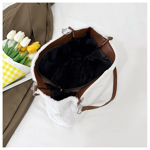 Top view of white faux fur tote bag showing spacious interior with black fabric lining