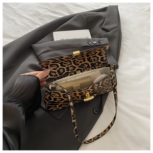 Interior view of leopard print baguette bag showing capacity for phone and essentials