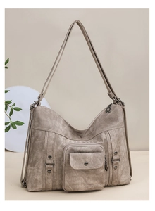 Detailed macro view of khaki vintage tote bag showing retro multi-pockets and metal rivets