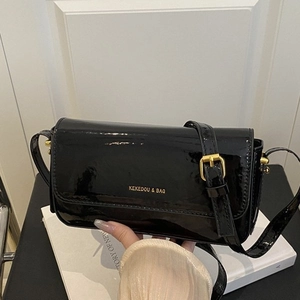 Classic black patent leather crossbody square bag with gold buckle and adjustable strap