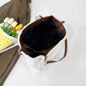 White faux fur tote bag with brown leather straps and spacious interior top view