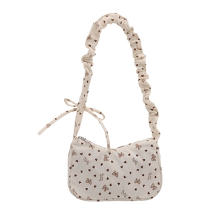Beige corduroy schoudertas met bruine hart- en strikprint en plooien details