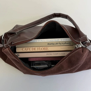 Interior view of large tote bag showing capacity for books, phone and sunglasses