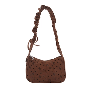Borsa a spalla in velluto a coste marrone con motivi a fiocco e tracolla arricciata
