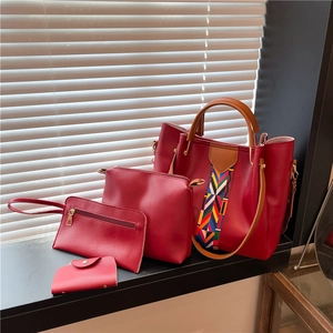 Red 4-piece handbag set featuring a large tote with ethnic woven strap detail