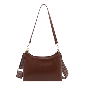 Brown faux leather baguette bag with dual straps in a minimalist trapezoid structure