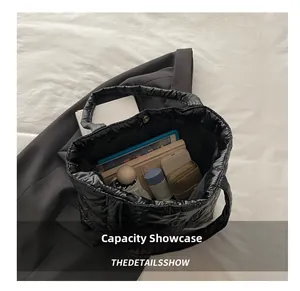 Top view of large black quilted tote bag interior showing spacious capacity for items