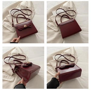 Dettaglio borsa a tracolla bordeaux con decorazione a fiocco e chiusura rotante dorata