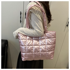 Detail of metallic pink quilted space cotton tote bag with puffy down texture design