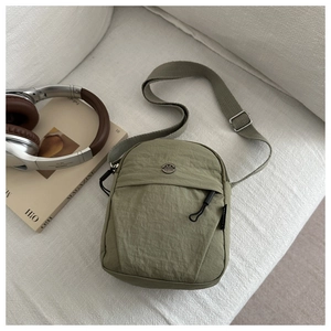 Olive green nylon crossbody bag with M FASHION logo and adjustable shoulder strap