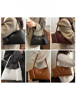 Detail of woven texture underarm bags in four colors with matching mini coin purses