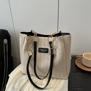Fashion woven straw tote bag with black leather straps and gold rings for women