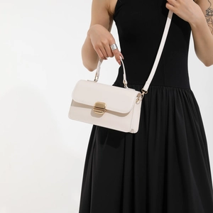Minimalist beige crossbody handbag with gold buckle and top handle for women