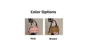 Detail of pink and brown cat-shaped crossbody bags showing faux suede texture and embroidery