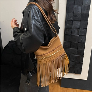 Brown faux leather hobo shoulder bag with bohemian fringe and metallic gold studs