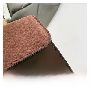 Macro detail of retro dual-texture brown suede and smooth leather with fine stitching