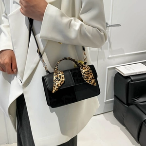 Black leather crossbody square bag with leopard print scarf handle for stylish commute