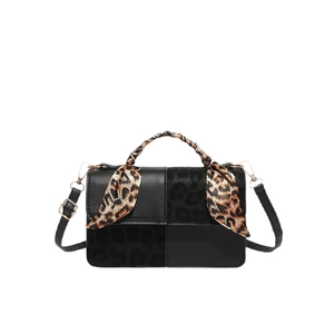 Elegant black leather handbag with leopard print panel and matching scarf wrap handle