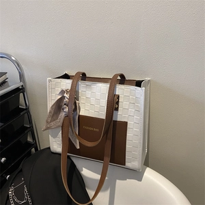 Minimalist tote bag with checkered pattern, silk scarf detail and brown pocket accents