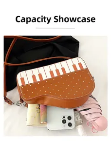 Internal capacity display of the piano keys shoulder bag showing daily essentials storage