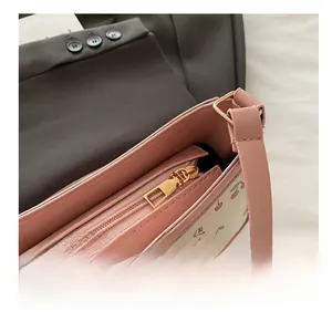 Macro view of smooth gold zipper and inner lining of the cherry print shoulder bag