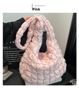 Detail of pink cloud bag showing soft bubble pleated texture and light nylon material