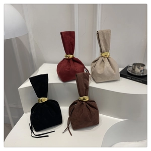 Minimalist drawstring bucket bag with gold metal hardware in four elegant colors