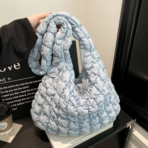 Light blue quilted puffer cloud bag with textured pleats and large capacity design
