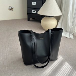 Premium black leather tote bag for women with large capacity and elegant gold lettering