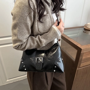 Vintage black leather hobo bag with silver rivets and buckle for casual commuting