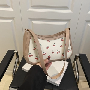 Chic cherry print underarm bag with khaki leather trim and stylish chain strap