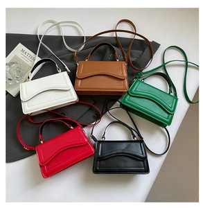 Variety of five elegant solid color flap handbags with unique wavy stitching details