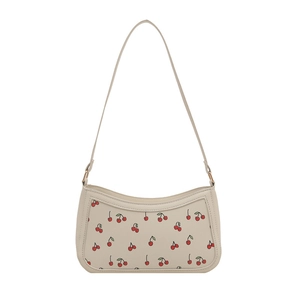 Chic cream underarm bag with red cherry print and gold chain strap for women
