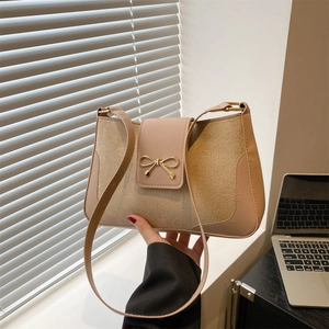 Chic khaki shoulder bag with gold bow accent and elegant mixed texture finish