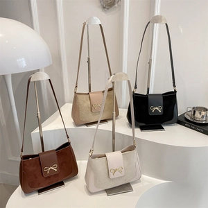 Minimalist rectangular crossbody bags with golden bow buckles in four neutral colors