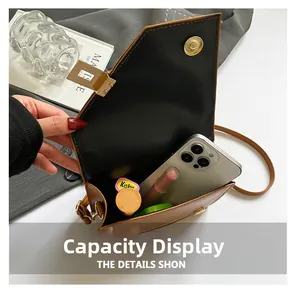 Detail view of brown leather crossbody bag showing interior space for phone and makeup
