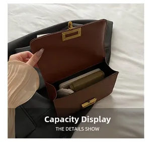 Internal view of brown leather crossbody bag showing storage space for phone and wallet