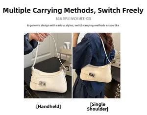 Detail showing creamy white half-moon shoulder bag with silver buckle and versatile straps
