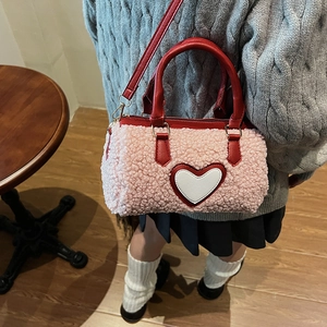 Pink sherpa crossbody bag with heart pattern and red leather handles for women
