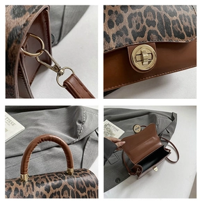 Detail of the leopard print flap and golden twist lock on a vintage shoulder bag