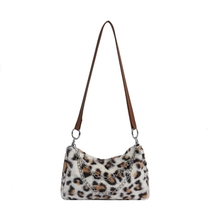 Plush leopard print crossbody bag with faux fur texture and silver chain accents