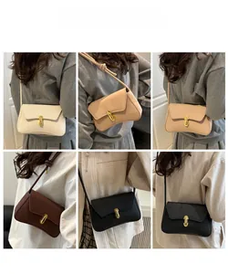 Detailed views of minimalist leather crossbody bags in beige, brown and black with gold clasps