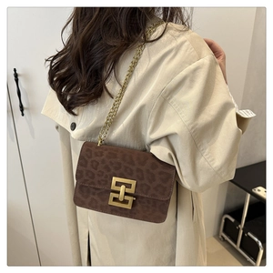 Chic brown leopard print crossbody bag with gold chain strap and metal buckle detail